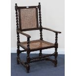 An 18th Century and later oak armchair, the cane seat and back raised on barley twist and block legs