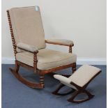 An early 20th Century bobbin turned fruitwood rocking armchair with shaped supports (alterations and