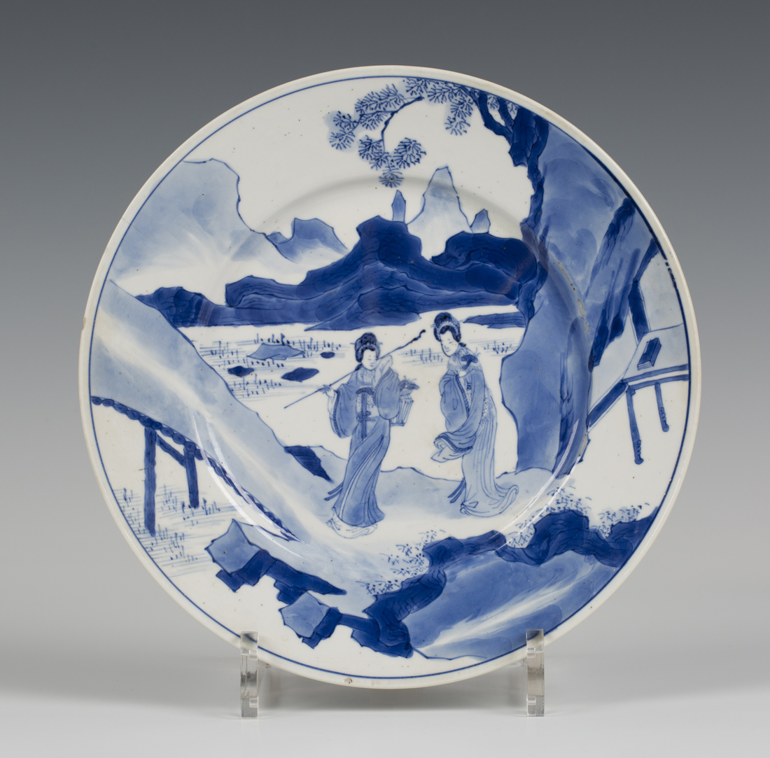 A Chinese blue and white porcelain plate, mark and period of Kangxi, painted with two maidens