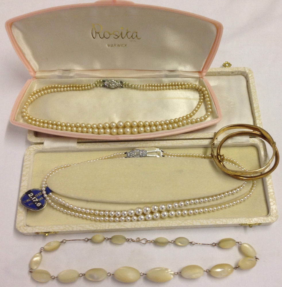 A collection of jewellery items to include: An antique necklace of graduated white oval stones