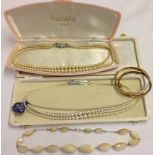 A collection of jewellery items to include: An antique necklace of graduated white oval stones