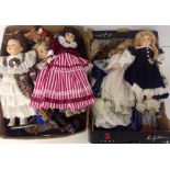 2 boxes of modern porcelain dolls to include dolls from across the world.