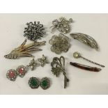 A basket of costume jewellery to include filigree and marcasite.