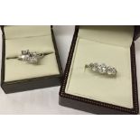 2 ladies silver dress rings set with large white stones. Both size S.