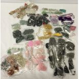 A large box of precious and semi precious stones and beads suitable for jewellery making. To include
