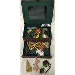 A tartan jewellery box containing some early plastic brooches, hair accessories, necklaces etc.