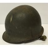 A c1960s American Infantry steel helmet with liner.