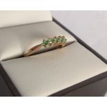 Ladies  9ct gold dress ring set with 5 peridots. Size N«. Approx 1.2g.