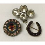 3 vintage brooches: 1) a micro mosaic with floral design. 2) a lucky horshoe set with garnets and 3)
