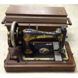 A vintage cased Singer sewing machine.