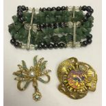 2 costume jewellery brooches by Hollywood. One set with turquoise stones and faux pearls, the