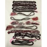 A collection of Garnet gem stone beads, to include faceted strings, round and shaped beads.