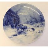 A hand painted Delft charger of sheep being penned for the night, signed by the artist. Blue written