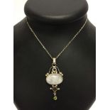 Silver pendant set with semi-precious stones on a silver 16" chain. Pendant measures approx 6cm long