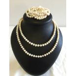 2 strings of freshwater pearls - each 46 inches long.