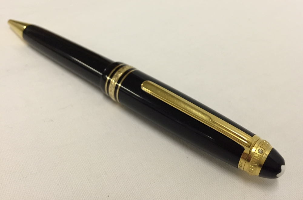 A Mont Blanc Meisterstuck 75th anniversary diamond set ballpoint pen. In black resin with gold