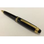 A Mont Blanc Meisterstuck 75th anniversary diamond set ballpoint pen. In black resin with gold