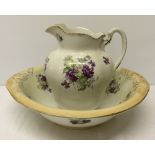 Large Edwardian jug & bowl with floral decoration - handle repaired.