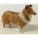 A Beswick Rough Collie dog approx 11cm long.
