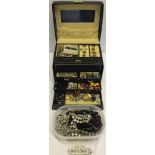 A black jewellery case containing vintage and modern costume jewellery, together with a tub