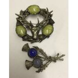 2 vintage Scottish design brooches, one with 2 thistles, the other with a stags head. Both set