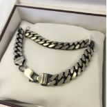 Heavy flat curb link silver bracelet. Approx 22cm long, weight approx 33.4g.