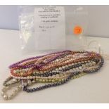 10 strings of cultured freshwater pearls - multicoloured .Loose-strung for jewellery making.