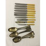 A quantity of mixed knives and spoons to include Walker & Hall.