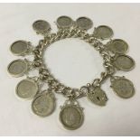 Silver bracelet with 12 silver 3 pence coins. 60.6g approx weight.
