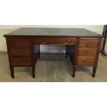 A vintage pedestal desk with green leather top made by Cooke's (Finsbury) Ltd. 5 ft (153cm) wide.