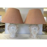 A pair of large peach & white table lamps with raised and applied flower decoration with peach