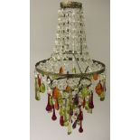 A small glass chandelier with coloured drops.