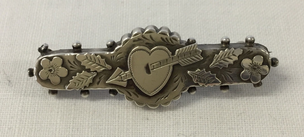 Antique silver bar brooch with a heart and arrow design, ideal for Valentines day. Has a Chester