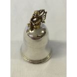 Hallmarked silver baby tooth keepsake bell shaped box.  Has a gilded tooth fairy sitting on the