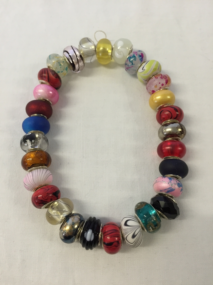 29 bead charms, mostly glass with 925 silver cores.