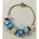 A Rhona Sutton silver bracelet and 7 Rhona Sutton Murano glass beads with 925 silver cores -