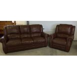 A large 3 seater brown leather settee and matching reclining armchair.