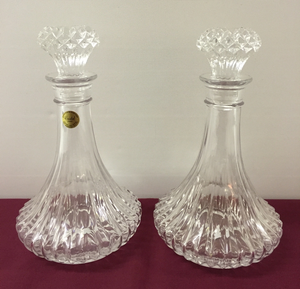 A pair of French cut crystal ships decanters, approx 25cm tall.