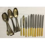 A quantity of mixed knives and spoons to include Walker & Hall.