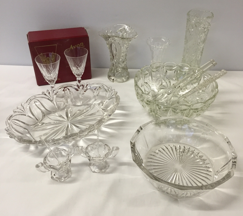 A collection of glass items to include a pair of salts with spoons.