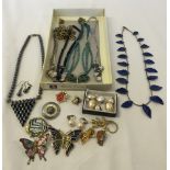 A box of jewellery to include a silver necklace and a Haematite necklace and earring set.