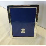 A boxed silver plated photo frame.