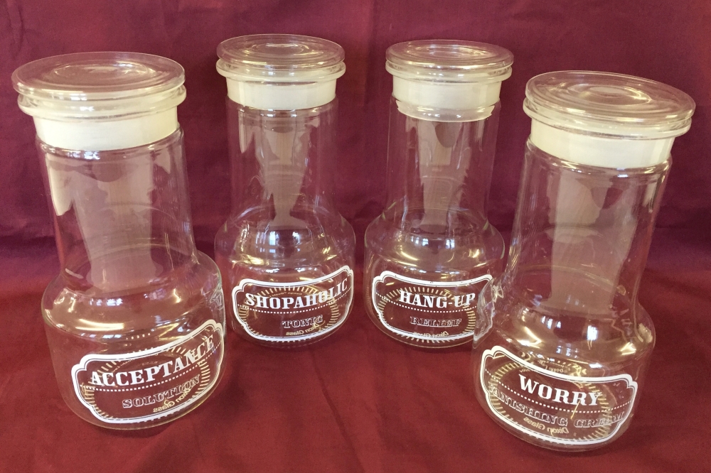 4 tall glass sweet jars.