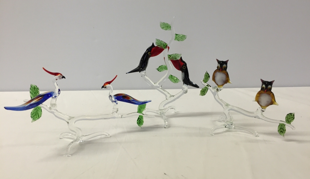 3 Murano glass ornaments featuring birds on branches. To include owls, toucans and birds of