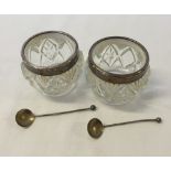 A pair of silver rimmed saltes with silver salt spoons. All hallmarked London 1918.