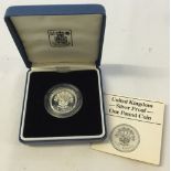 A 1986 silver proof one pound coin in presentation case.
