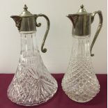 2 claret jugs with silver plated handles and tops.  One is cut crystal, ships decanter shape with