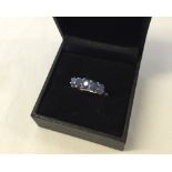 A blue sapphire & diamond silver ring size K (boxed).