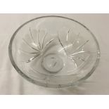 A crystal bowl with petal design and etched 'M' mark to base.