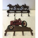 2 cast iron reproduction coat racks.